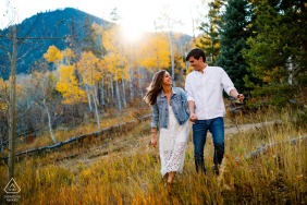 Rocky Mountains pre-wedding photo session with an engaged couple in Frisco, CO with a couple on one of their Fall walks