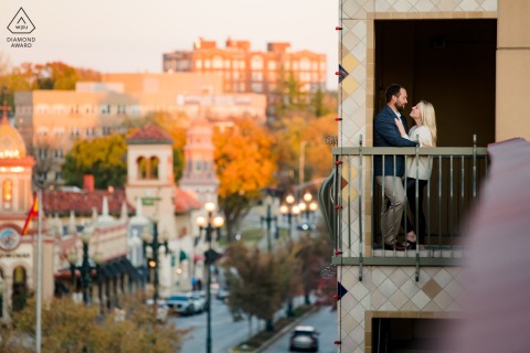 A couple was photographed in a Kansas City parking garage doorway with the skyline in the background