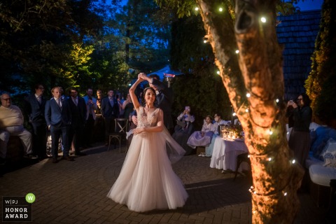 The first dance with the bride and groom at their outdoor reception at the Cafe Cortina, Farmington, MI	
